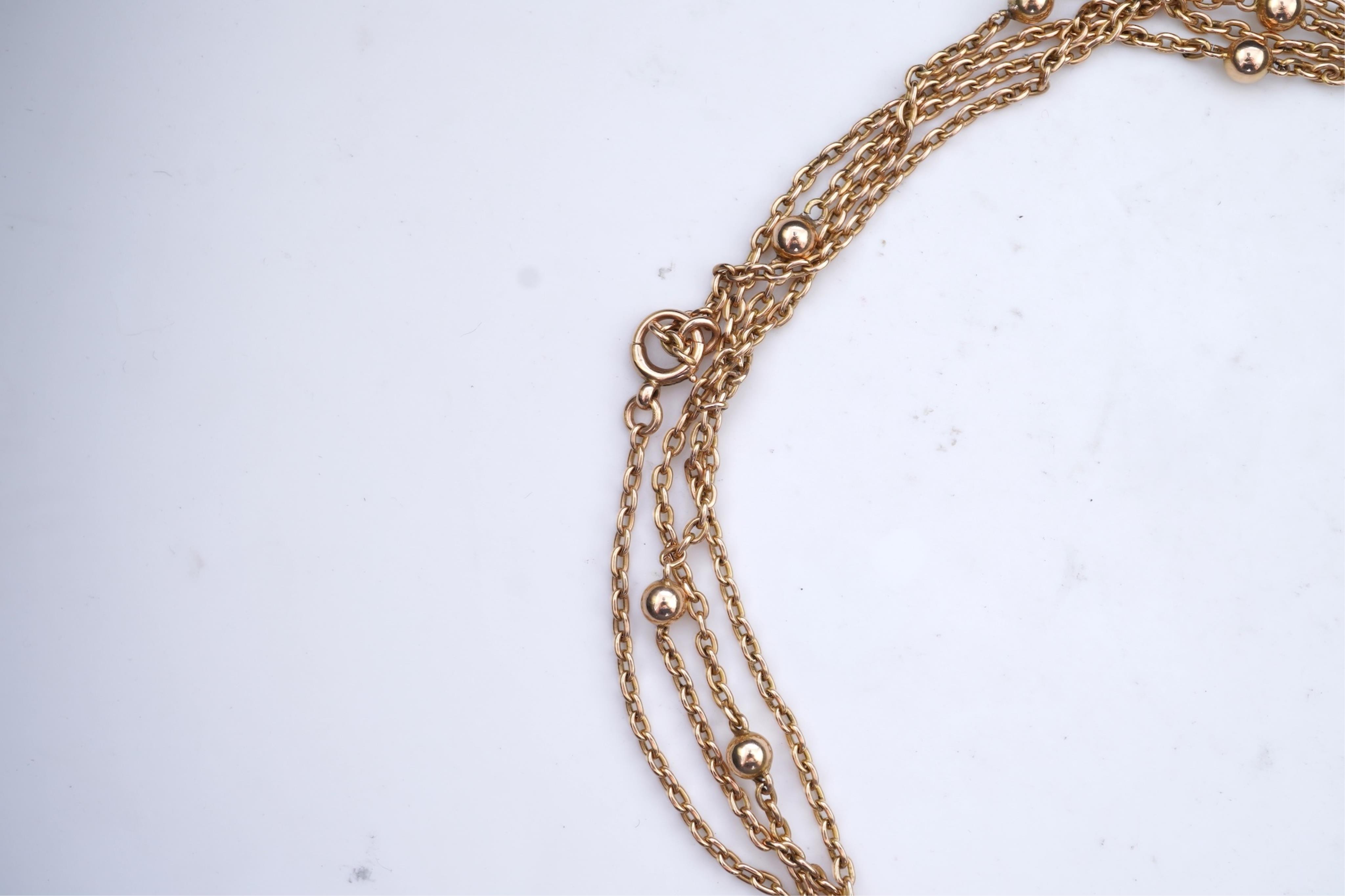 A gold long guard chain, early 20th century